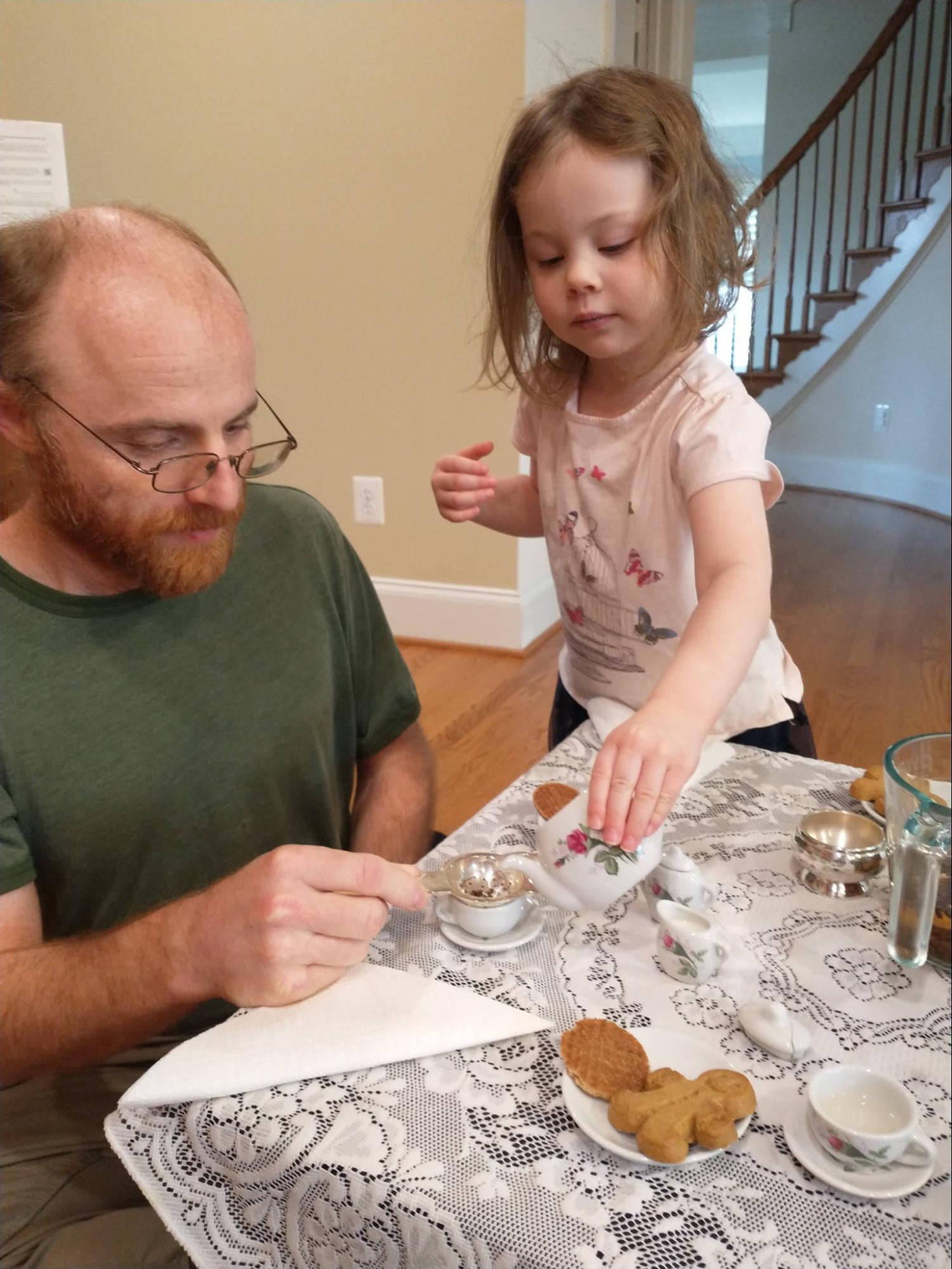 Child pouring tea