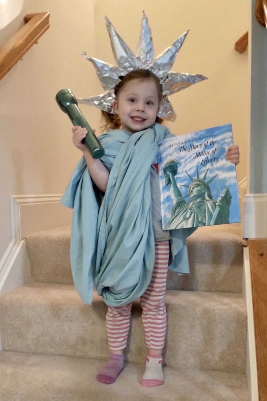 Girl dressed as Statue of Liberty