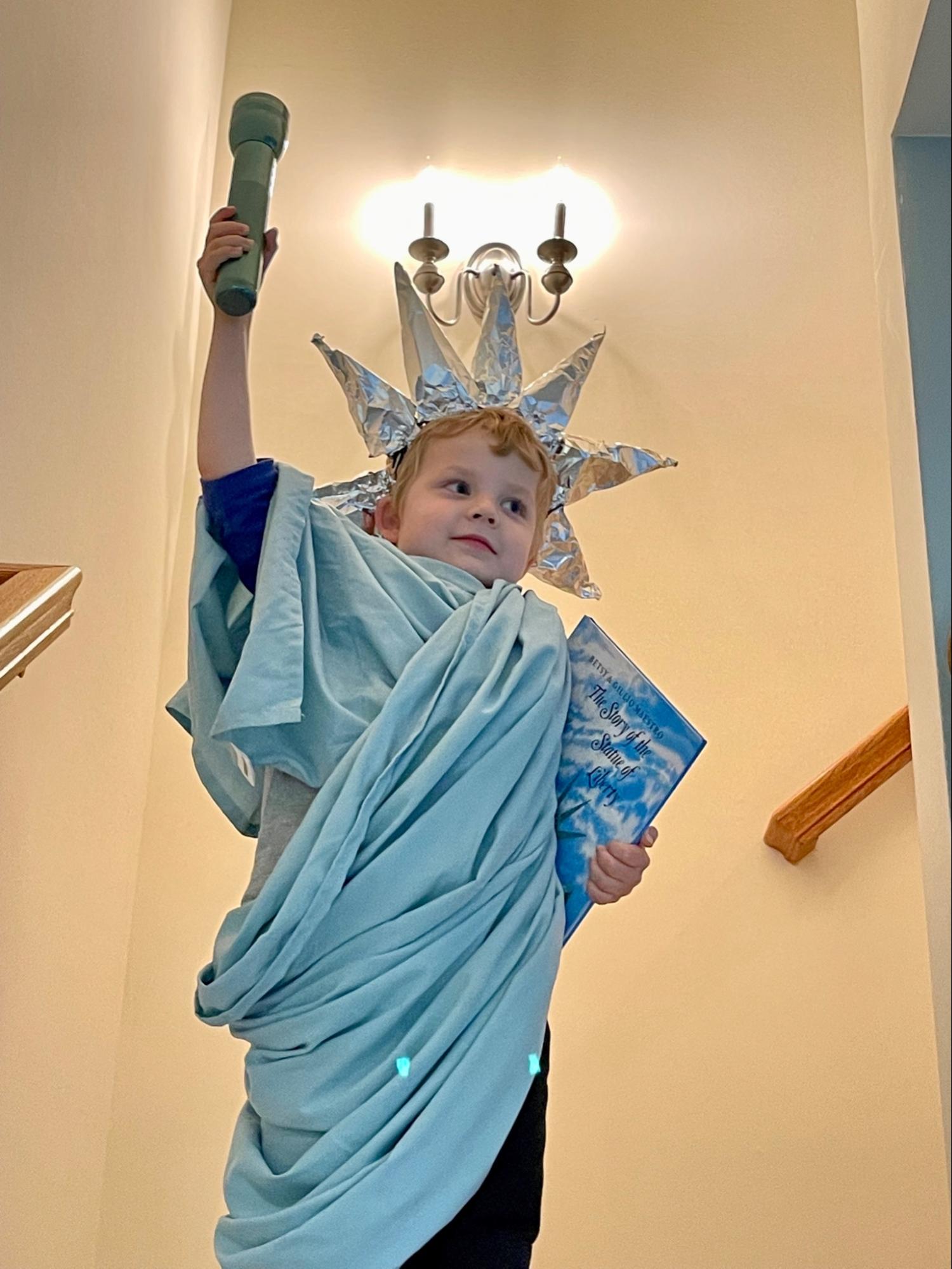 Boy dressed as Statue of Liberty