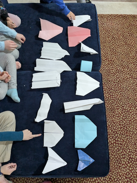 Paper planes lined up